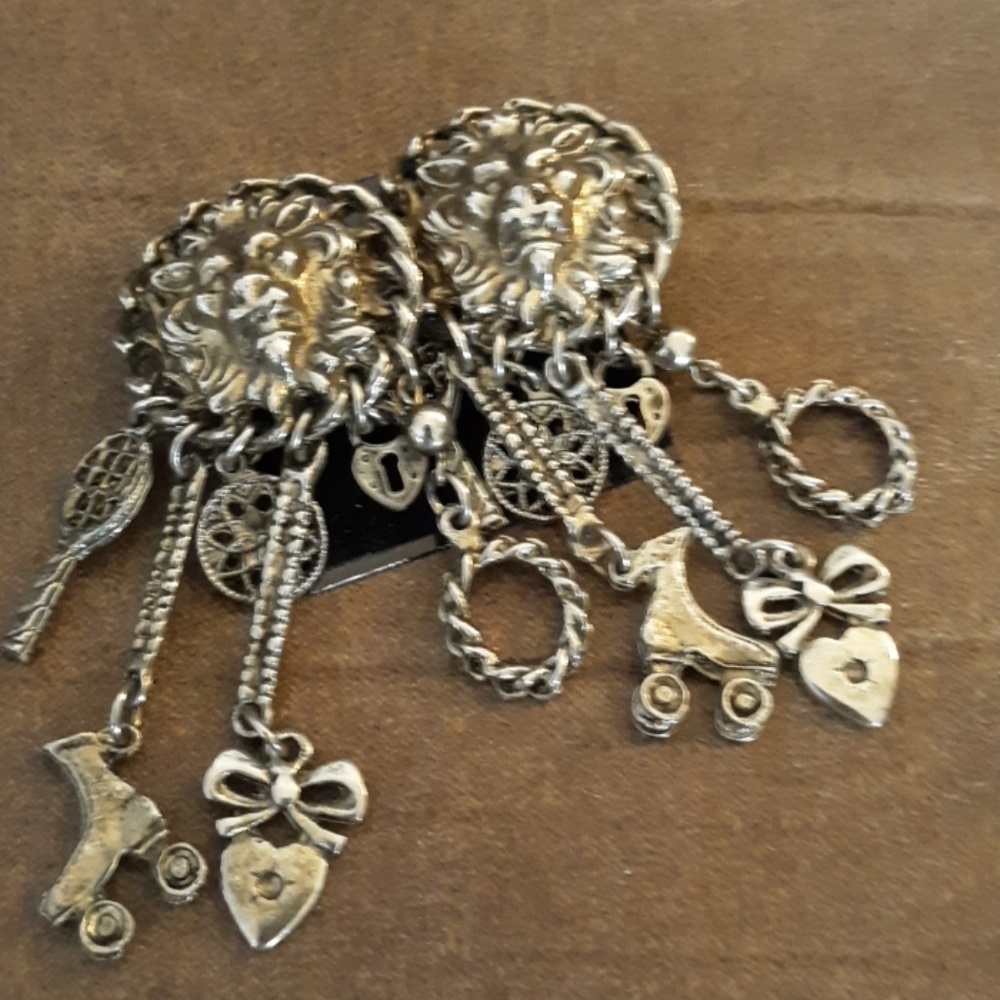 There are ladies antique look charms pierced earri